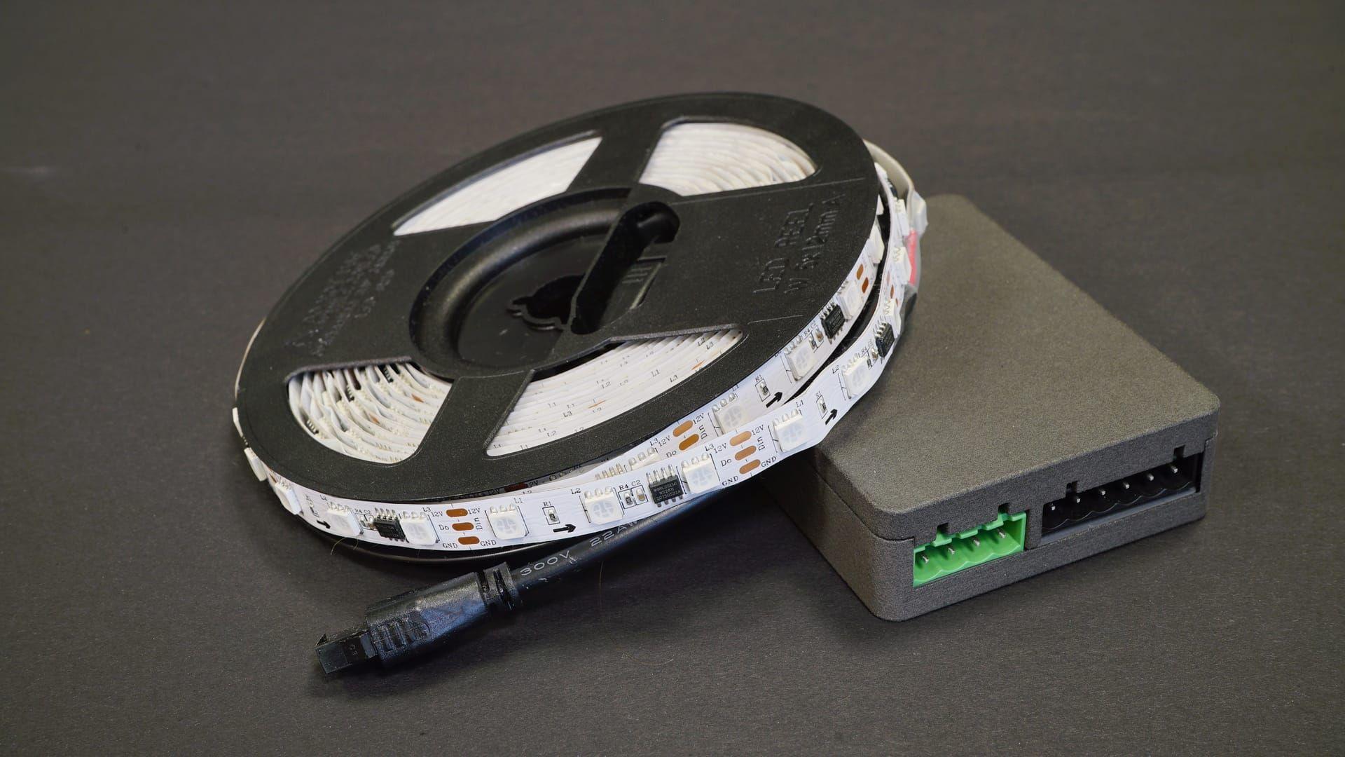 Starter bundle box – controller, 12v WS2815 5m LED strip, 12v power supply, and clamps neatly arranged